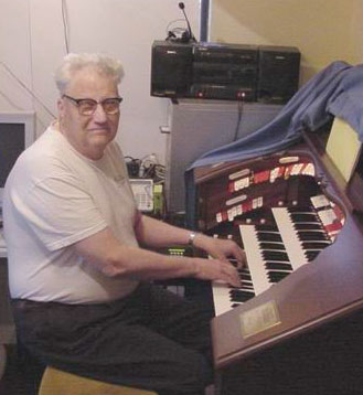 Click here to download a 640 x 480 JPG image of Clint Savage at the console of his Mighty Allen GW-319 Digital Theatre Organ.