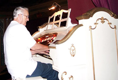 Click here to download a 700 x 472 JPG image showing Eugene Hayek at the console of the Lafayette Theatre's Mighty 2/11 WurliTzer Theatre Pipe Organ.