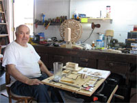 Click here to download a 2592 x 1944 JPG image shoving Papa Bill in his shop surrounded by his tools and work.