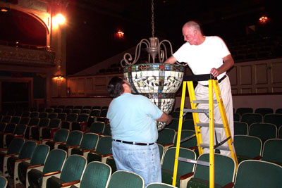 Click here to download a 2160 x 1440 JPG image showing Nelson Page and Bob Miloche changing lightbulbs in one of the chandeliers at the Lafayette Theatre.