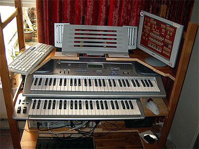 Download an 800 x 600 JPG image of Russ Ashworth's Mighty MidiTzer console, second version.