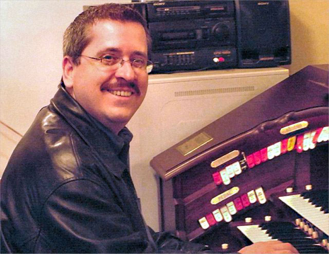 Download a 1024x792 JPG image of the renouned theatre organist Walt Strony at the console of Clint Savage's Allen GW-319 Digital Theatre Organ.