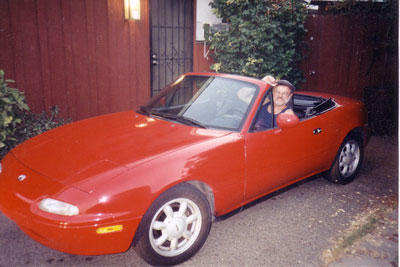 Click here to download a 1772 x 1184 JPG image showing Paul Kealy seated in his bright red Zoomer!