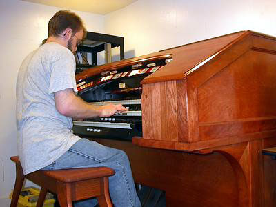 Click here to download a 1600 x 1200 JPG image showing Aaron at the console of his converted Kilgen Theatre Organ.