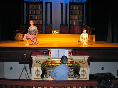 Click here to download a 2816 x 2112 JPG image showing Tom Hoehn at the console performing for a show on the stage of the auditorium.