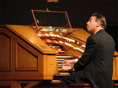 Click here to download a 2592 x 1944 JPG image showing Jelani Eddington at the console of the J. Tyson Forker Memorial 4/32 Mighty WurliTzer.