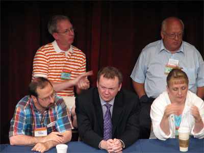 Click here to download a 2592 x 1944 JPG image showing Russell Holmes (center) with fellow board members Michael Fellenzer and Doug Powers (left) along with Bob Favidson and Donna Parker (right) at the Tampa Theatre during the 51st Annual ATOS Convention of 2006.