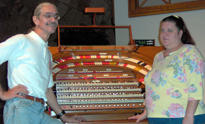 Click here to download a 2049x 1250 JPG image of Doc and Kimmy standing at the console of the J.Tyson Forker Memorial 4/32 Mighty WurliTzer Theatre Pipe Organ installed at Grace Baptist Church in Sarasota, Florida.