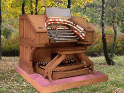 Download a 1024 x 768 wallpaper featuring the J. Tyson Forker 4/32 Mighty WurliTzer console sitting in the woods!
