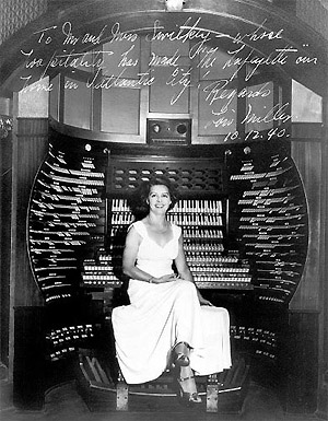 Click here to download a 390 x 500 JPG image showing Loise Miller at the console.