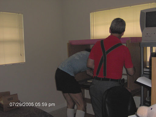 Click here to download a 2048 x 1536 JPG image of Doc and Tom prepping the new temporary office for Walnut Hill.