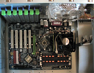 Click here to download a 1821 x 1407 JPG image showing the motherboard being fitted inside the case.