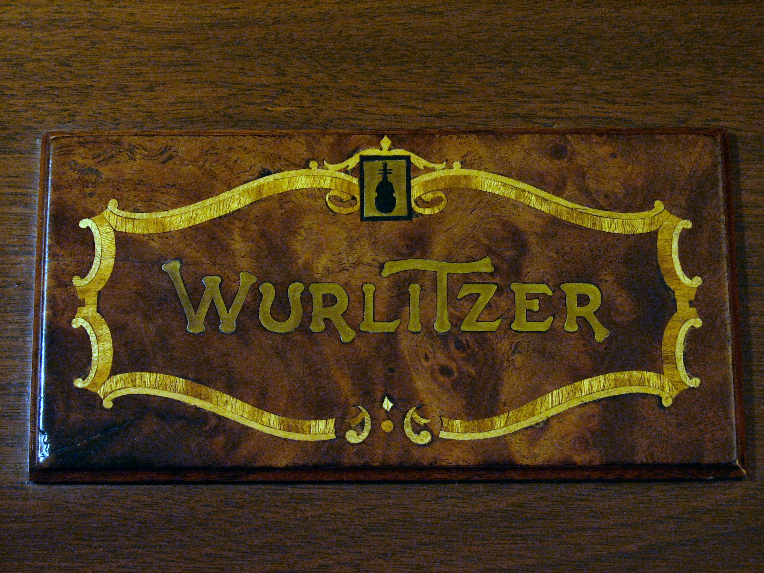 Click here to download a 2592 x 1944 JPG image showing one of the two WurliTzer badges.