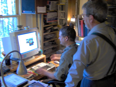 Click here to download a 2046 x 1536 JPG image showing John 'the Art Rat' and Tom Hoehn working on the final artwork setup for the four-page Sounds of Grace CD booklet.
