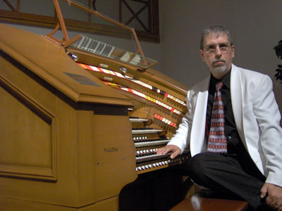 Click here to download a 2048 x 1536 JPG image showing Tom Hoehn at the console of the J. Tyson Forker Memorial WurliTzer Theatre Pipe Organ installed at Grace Baptist Church in Sarasota, Florida.