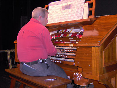 Click here to download a 2048 x 1536 JPG image showing Tom Hoehn at the console of the 3/16 Mighty WurliTzer Theatre Pipe Organ installed at Tom Worthington High School, Columbus, Ohio.