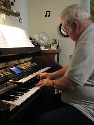 Click here to download a 1932 x 2576 JPG image showing Cyrus Roton at the console of Eleanor Winnemore's Roland Atelier Digital Residence Organ.